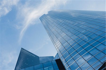 Facade of skyscrapers against sky, low angle view Stock Photo - Premium Royalty-Free, Code: 632-06317474