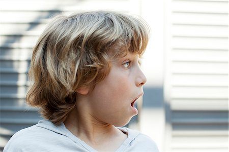 Boy looking away with shocked expression Stock Photo - Premium Royalty-Free, Code: 632-06317700