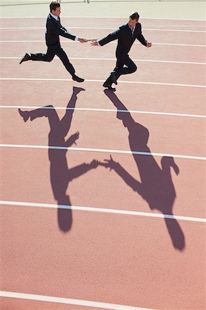 Businessmen running relay race Foto de stock - Sin royalties Premium, Código: 632-06317899