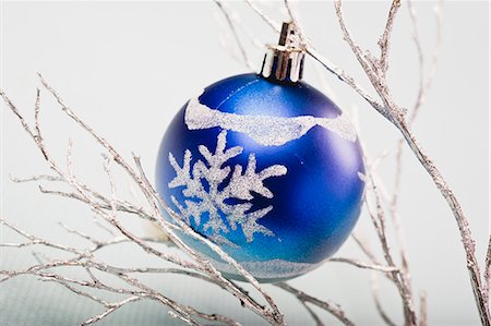 snow christmas nobody - Blue bauble hanging from silver branches Stock Photo - Premium Royalty-Free, Code: 632-06354128