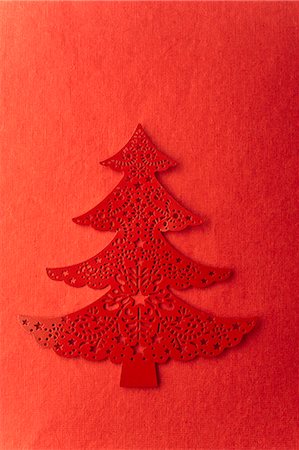 Christmas tree shape on red background Stock Photo - Premium Royalty-Free, Code: 632-06354210