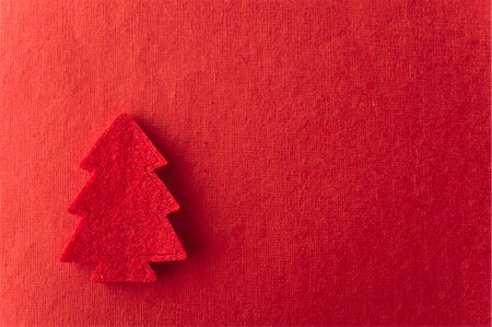 Christmas tree shape on red background Stock Photo - Premium Royalty-Free, Code: 632-06354221