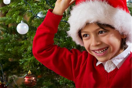 Boy wearing Santa hat, portrait Stock Photo - Premium Royalty-Free, Code: 632-06354428