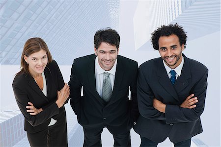 simsearch:632-06118621,k - Team of executives smiling confidently with skyscrapers superimposed on background Stock Photo - Premium Royalty-Free, Code: 632-06354451