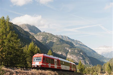 Train moving through mountain landscape Stock Photo - Premium Royalty-Free, Code: 632-06353980