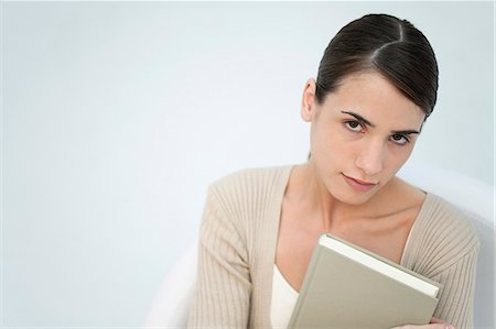 people reading cutout - Young woman holding book, portrait Stock Photo - Premium Royalty-Free, Code: 632-06404412