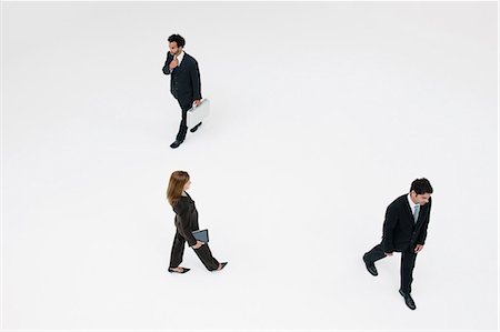 people walking white background - Business professionals on the move Stock Photo - Premium Royalty-Free, Code: 632-06404567