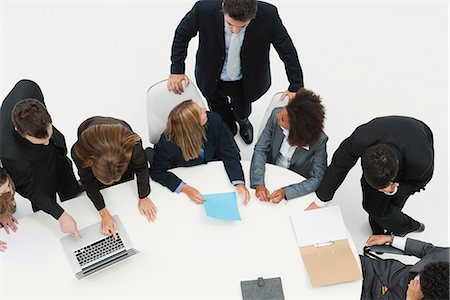 sitting at table white background - Working meeting Stock Photo - Premium Royalty-Free, Code: 632-06404582