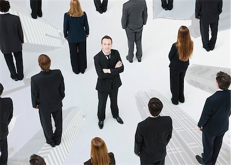 Ambitious businessman standing out from the crowd Stock Photo - Premium Royalty-Free, Code: 632-06404662