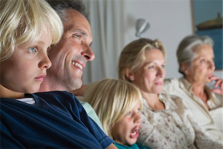 senior man watching tv family - Family watching TV together Stock Photo - Premium Royalty-Free, Code: 632-06779244