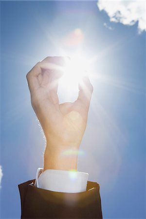 Sunlight through fingers, cropped Stock Photo - Premium Royalty-Free, Code: 632-06779318