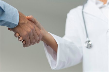 doctor patient compassion - Doctor shaking patient's hand, cropped Stock Photo - Premium Royalty-Free, Code: 632-06779327