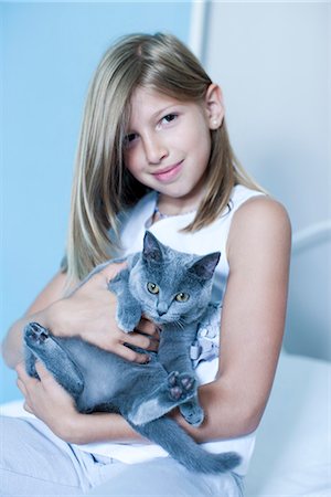 elementary age 2012 - Girl holding Russian Blue, portrait Stock Photo - Premium Royalty-Free, Code: 632-06967565