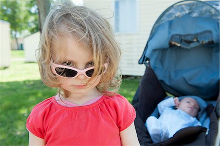 Little girl wearing sunglasses, portrait Stock Photo - Premium Royalty-Free, Code: 632-06967719