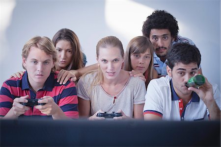 simsearch:625-02932991,k - Friends playing video games together Stock Photo - Premium Royalty-Free, Code: 632-07161543