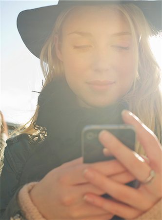 fashion texting - Young woman using smartphone Stock Photo - Premium Royalty-Free, Code: 632-07539875