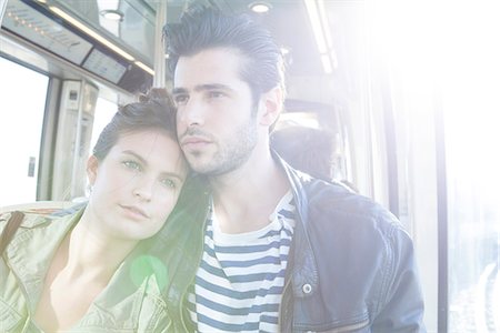 people traveling - Couple together on train, woman resting her head on man's shoulder Stock Photo - Premium Royalty-Free, Code: 632-07539935