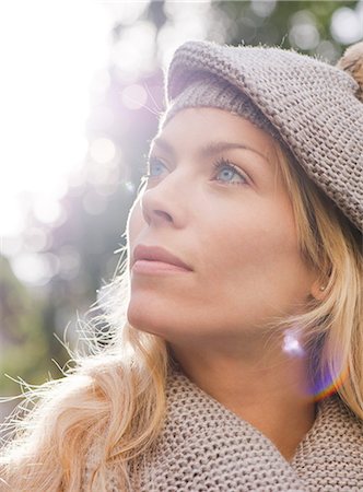 dreamy - Woman outdoors, looking up in thought, portrait Stock Photo - Premium Royalty-Free, Code: 632-07539940