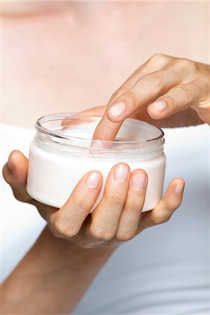 Woman using moisturizing cream Stock Photo - Premium Royalty-Free, Code: 632-07540017