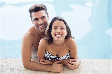 swimming pool of the hotel - Young couple in pool together, portrait Stock Photo - Premium Royalty-Free, Code: 632-07674492