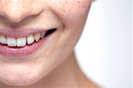 smile women face - Young woman's lips, close-up Stock Photo - Premium Royalty-Free, Code: 632-07674562