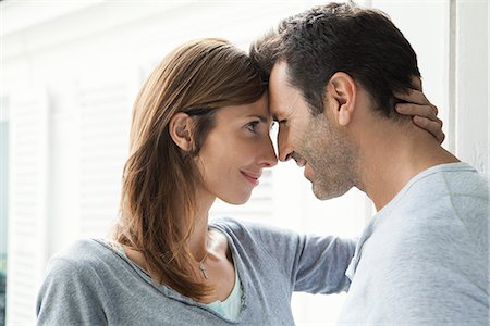 romanticism - Couple touching noses by window Stock Photo - Premium Royalty-Free, Code: 632-07674657