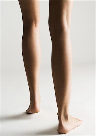 Woman's bare legs, rear view Stock Photo - Premium Royalty-Free, Code: 632-07674660