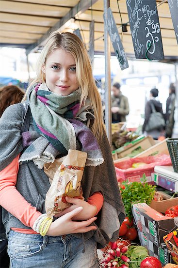 Young woman at greengrocer's buying fresh fruits and vegetables Stock Photo - Premium Royalty-Free, Image code: 632-07809326