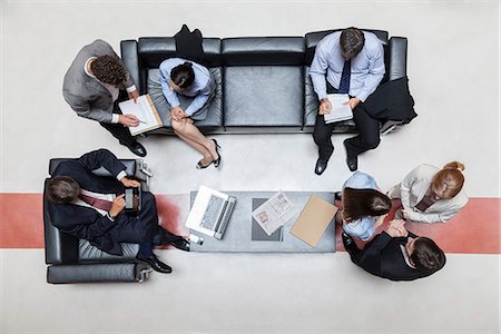 simsearch:632-08698428,k - Executives in meeting, overhead view Stock Photo - Premium Royalty-Free, Code: 632-07809421