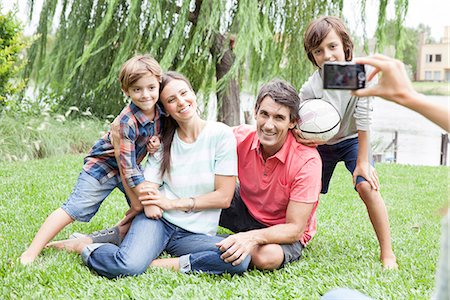 family football park - Using digital camera to photograph family with two children, personal perspective Stock Photo - Premium Royalty-Free, Code: 632-08001606