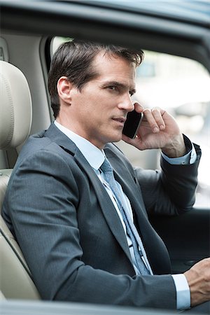 Man talking on cell phone while driving Stock Photo - Premium Royalty-Free, Code: 632-08001837