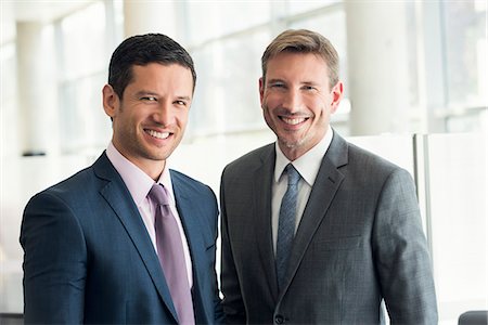 dos (cantidad) - Businessmen smiling, portrait Foto de stock - Sin royalties Premium, Código: 632-08001893
