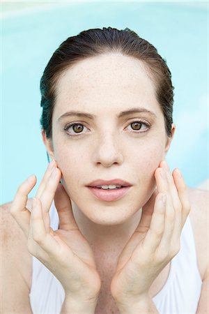 preventative - Young woman touching her face, portrait Stock Photo - Premium Royalty-Free, Code: 632-08129739