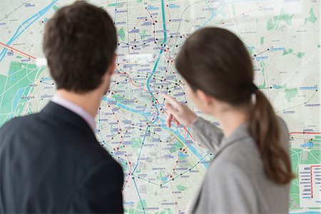 simsearch:632-08129867,k - Man and woman looking at Paris metro map together Stock Photo - Premium Royalty-Free, Code: 632-08129868