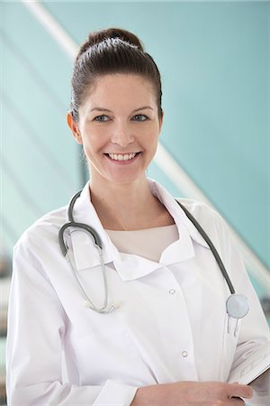 portrait of a woman and healthcare - Doctor smiling cheerfully, portrait Stock Photo - Premium Royalty-Free, Code: 632-08129878