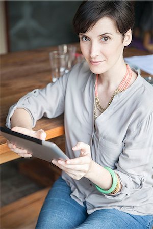 portrait casual indoors not mature not child - Woman using digital tablet, portrait Stock Photo - Premium Royalty-Free, Code: 632-08129997