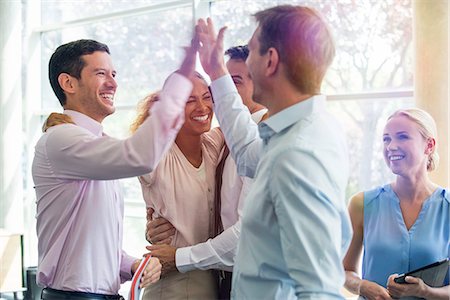 five (quantity) - Colleagues giving each other high-five Stock Photo - Premium Royalty-Free, Code: 632-08130024