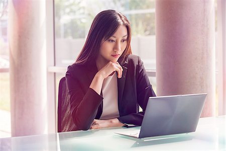 female professional portrait - Woman using laptop computer Stock Photo - Premium Royalty-Free, Code: 632-08130158