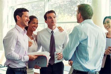 simsearch:632-08130024,k - Business team members having lighthearted moment together Stock Photo - Premium Royalty-Free, Code: 632-08130215
