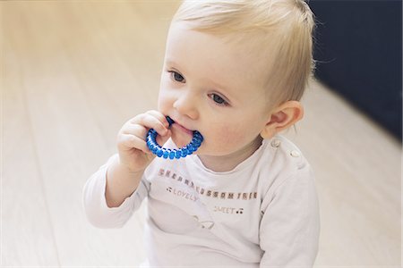 Baby chewing on teething ring Stock Photo - Premium Royalty-Free, Code: 632-08130258