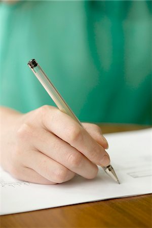 Applicant completing job application Stock Photo - Premium Royalty-Free, Code: 632-08227474