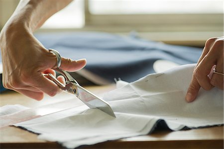 sewing material - Woman cutting fabric, cropped Stock Photo - Premium Royalty-Free, Code: 632-08227697