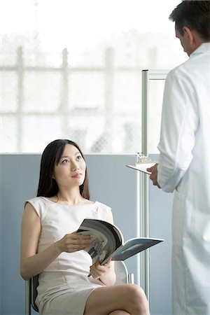 doctor and waiting room - Doctor speaking to patient in waiting room Stock Photo - Premium Royalty-Free, Code: 632-08227723