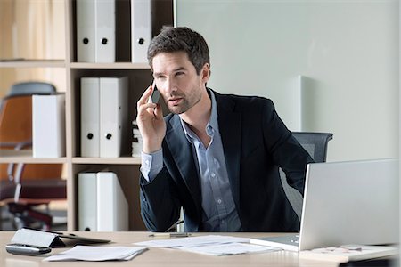 portrait business looking away - Businessman making important phone call Stock Photo - Premium Royalty-Free, Code: 632-08227747