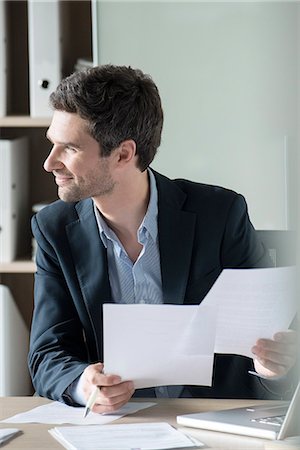 simsearch:632-08227744,k - Office worker bored with paperwork Stock Photo - Premium Royalty-Free, Code: 632-08227742