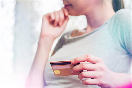 simsearch:632-03651843,k - Woman holding credit card, cropped Stock Photo - Premium Royalty-Free, Code: 632-08331418