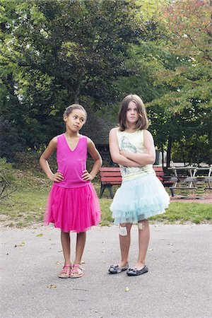 Girls dressed in tutus with tough expression on faces Stock Photo - Premium Royalty-Free, Code: 632-08331455