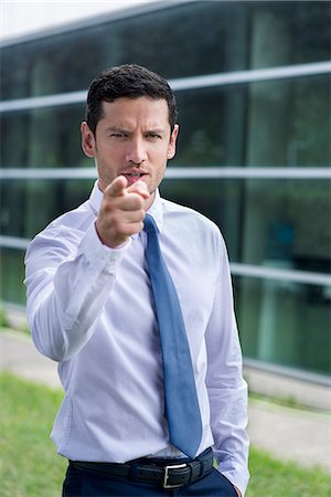 scolding - Businessman pointing finger in accusation Foto de stock - Sin royalties Premium, Código: 632-08331617