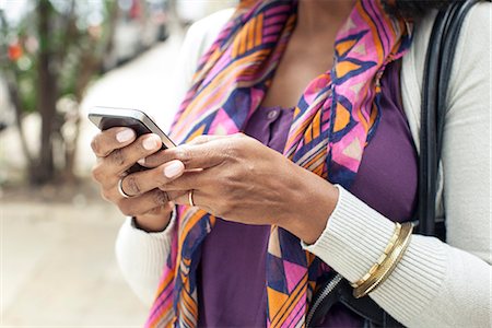 Woman using cell phone Stock Photo - Premium Royalty-Free, Code: 632-08331646