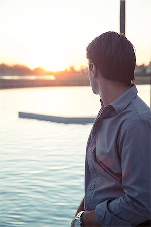 simsearch:632-08331750,k - Man looking at sunset Stock Photo - Premium Royalty-Free, Code: 632-08545903